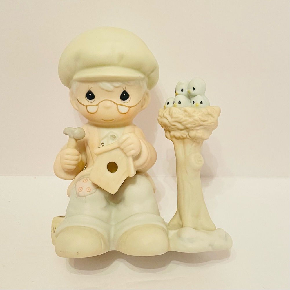 Precious Moments Figurine Only Love Can Make A Home Man fixing bird house